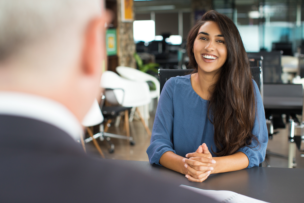 woman being interviewed; interview preparation tips for candidates